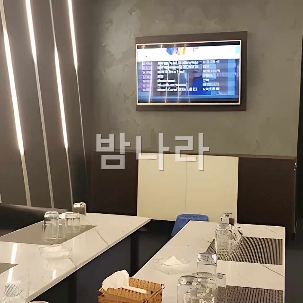 호치민 넘버원 가라오케 양주와 잔이 놓인 룸 테이블